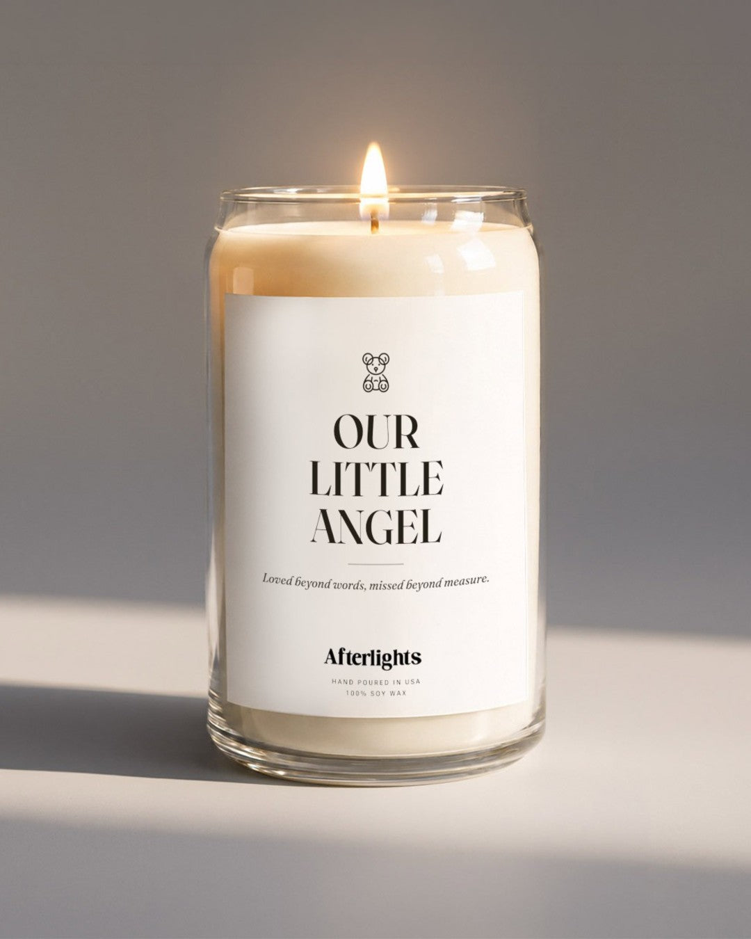 Child loss memorial candle that says Our Little Angel with a teddy bear symbol