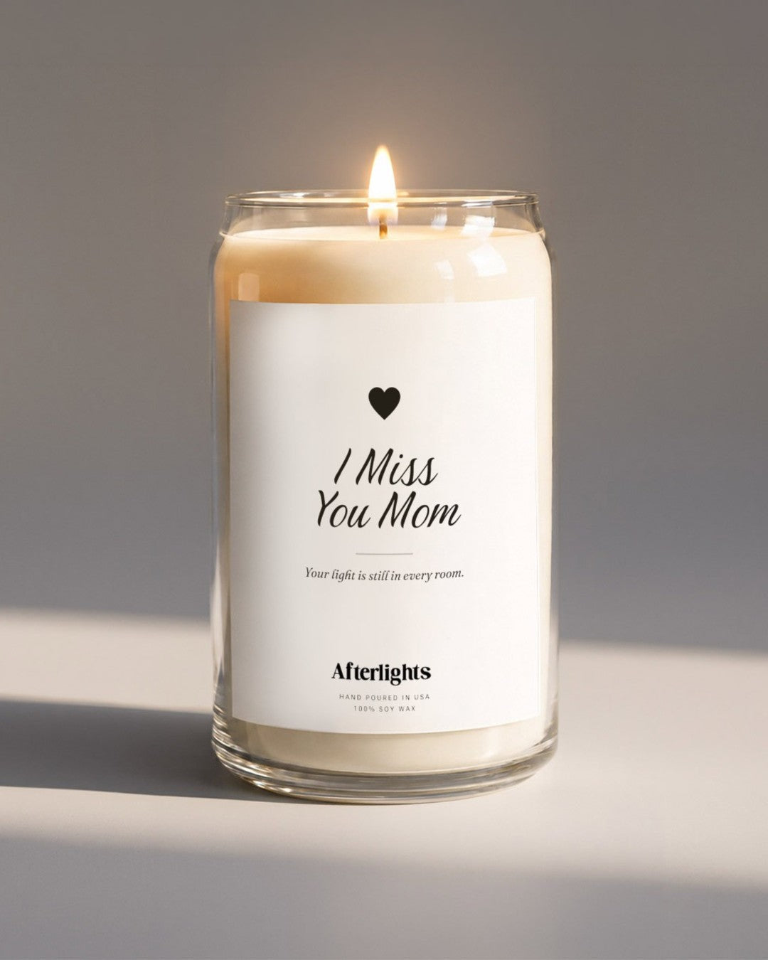 Memorial candle that says I Miss You Mom with a heart